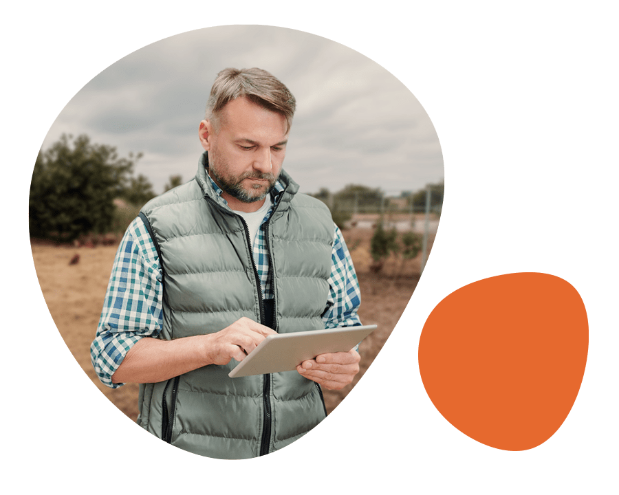 Farmer using an avian influenza prevention checklist on his tablet